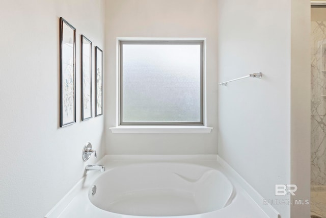 bathroom featuring a washtub