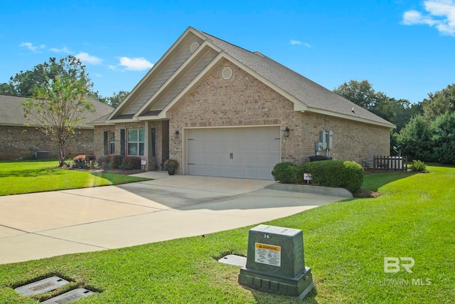 view of front of home with a garage and a front lawn