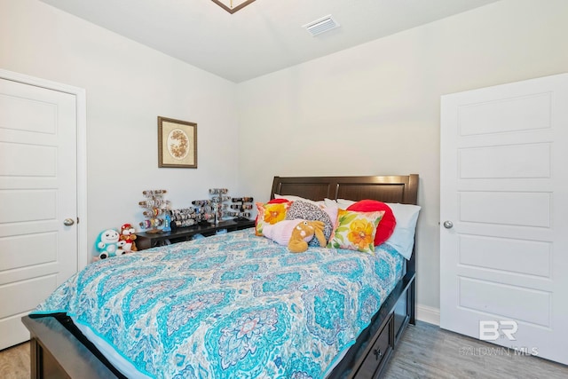 bedroom with light hardwood / wood-style flooring