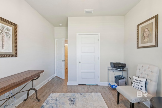 sitting room featuring light wood-type flooring