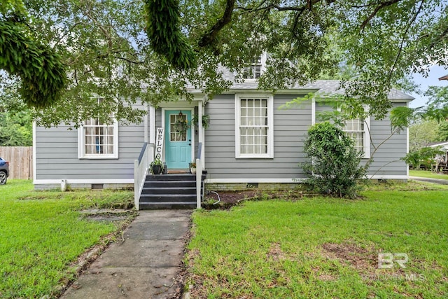 bungalow-style house with a front lawn