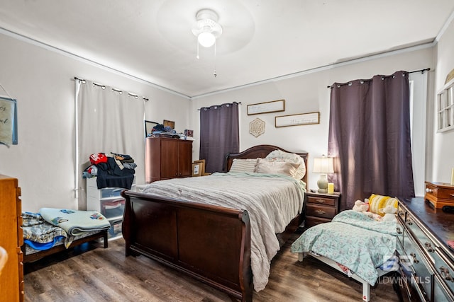 bedroom with dark wood-type flooring and ceiling fan