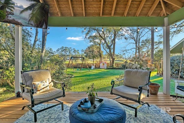 exterior space with a shed, a playground, a gazebo, and a wooden deck