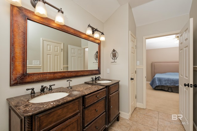 bathroom with tile patterned floors and vanity