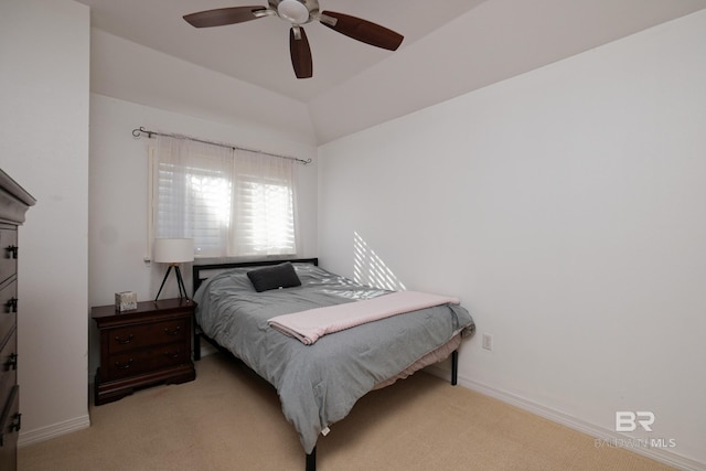 bedroom featuring ceiling fan, light colored carpet, and vaulted ceiling