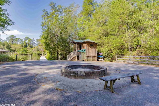 view of property's community with a playground