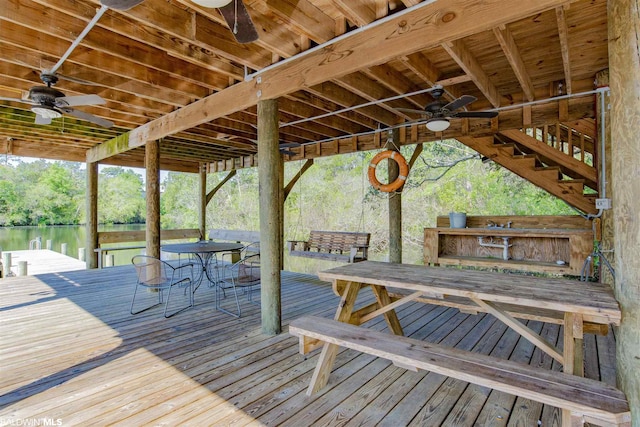 wooden terrace featuring ceiling fan