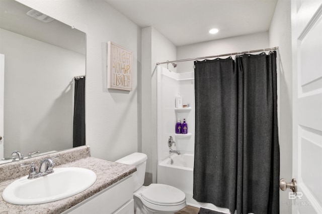 full bathroom featuring vanity, toilet, and shower / bath combo