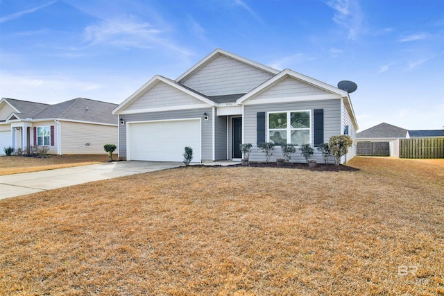 view of front of property with a garage and a front yard