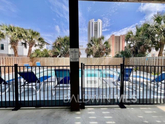 view of gate with a community pool