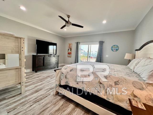 bedroom featuring access to outside, light hardwood / wood-style flooring, ceiling fan, and crown molding