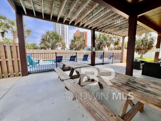 view of patio / terrace featuring a fenced in pool