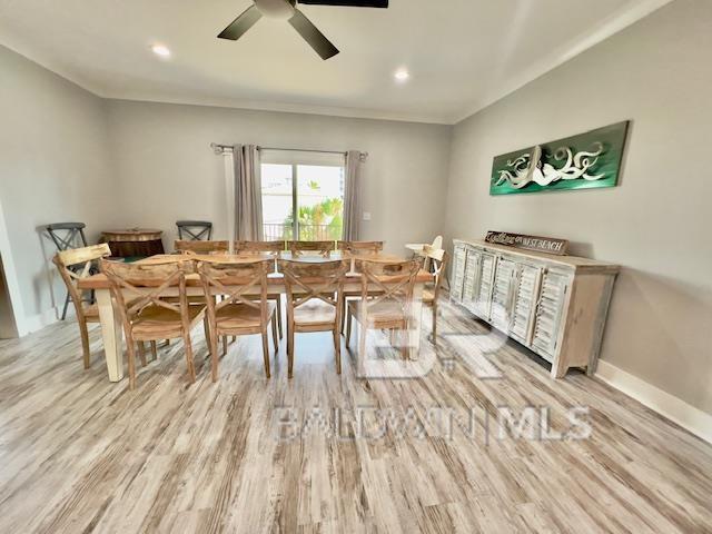 dining space featuring light hardwood / wood-style floors and ceiling fan