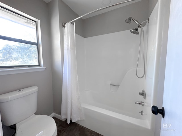 full bathroom with toilet and shower / bathtub combination with curtain