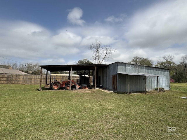 1104 N Pine St, Foley, AL 36535 - view of pole building with a lawn and fence