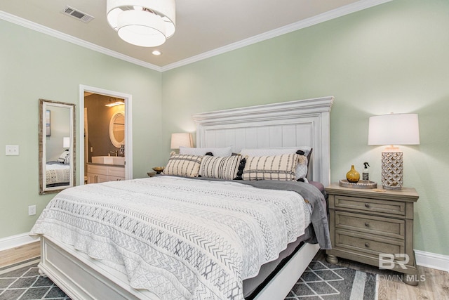 17290 Perdido Key Dr Unit 5B, Pensacola, FL 32507 - bedroom with dark wood-type flooring, visible vents, ornamental molding, and baseboards