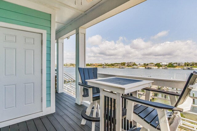 17290 Perdido Key Dr Unit 5B, Pensacola, FL 32507 - wooden deck featuring a water view