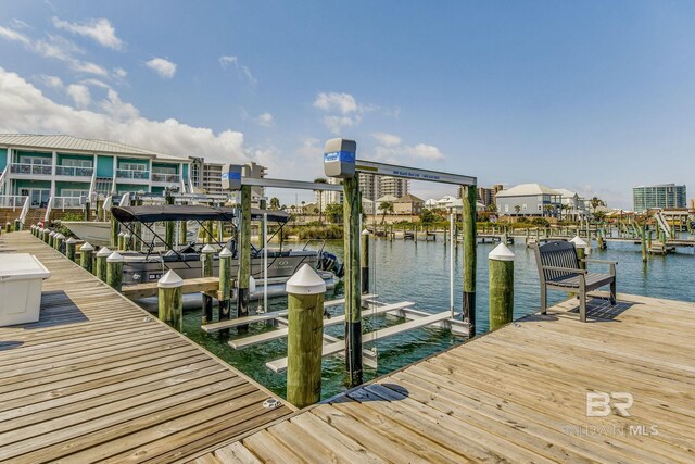 17290 Perdido Key Dr Unit 5B, Pensacola, FL 32507 - dock area featuring a water view and boat lift