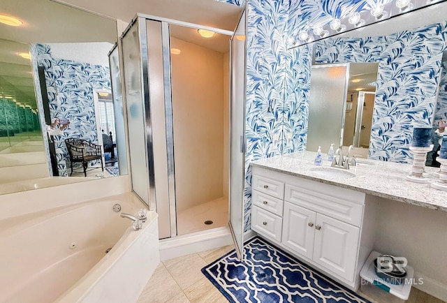 full bathroom with tile patterned flooring, vanity, wallpapered walls, a tub with jets, and a stall shower