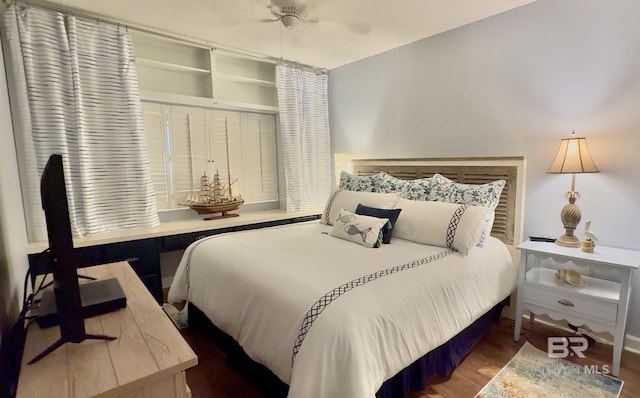 bedroom with a ceiling fan and wood finished floors