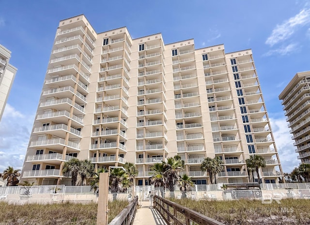 view of building exterior with fence