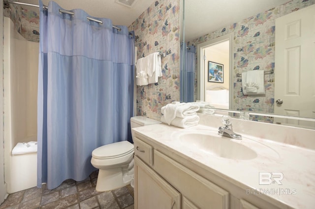 bathroom with vanity, a shower with shower curtain, a textured ceiling, and toilet