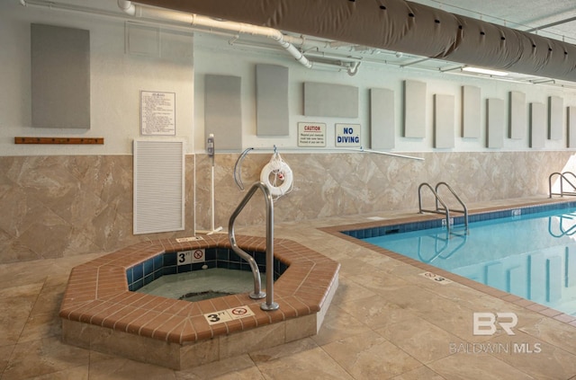 view of pool featuring an indoor in ground hot tub