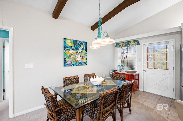 dining area with vaulted ceiling with beams and baseboards