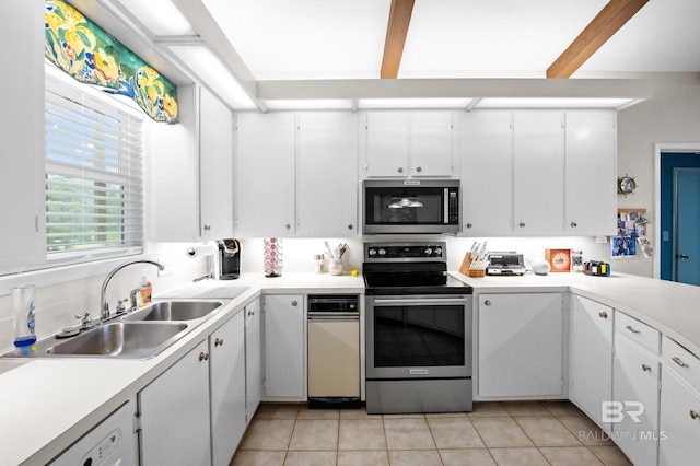 kitchen with light countertops, appliances with stainless steel finishes, and white cabinets