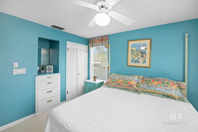 bedroom with a closet, visible vents, carpet flooring, ceiling fan, and baseboards