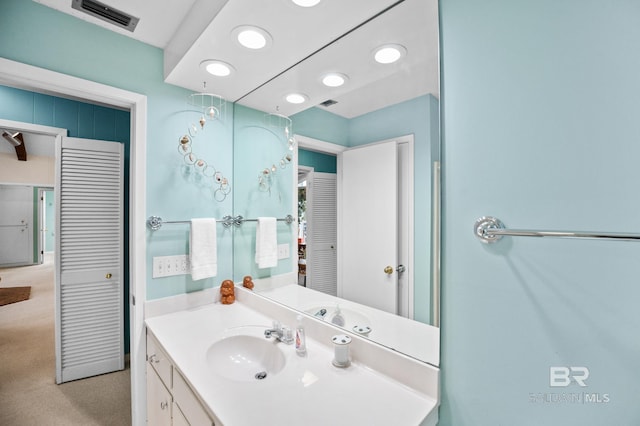 bathroom featuring visible vents and vanity