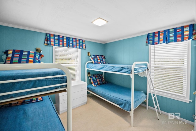 carpeted bedroom featuring ornamental molding