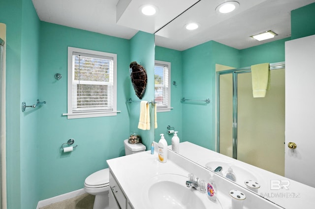 full bathroom featuring recessed lighting, toilet, a shower stall, vanity, and baseboards