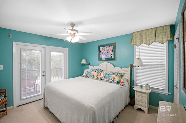 bedroom featuring light carpet, access to exterior, ceiling fan, and baseboards