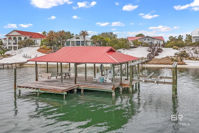 view of dock featuring a water view and boat lift