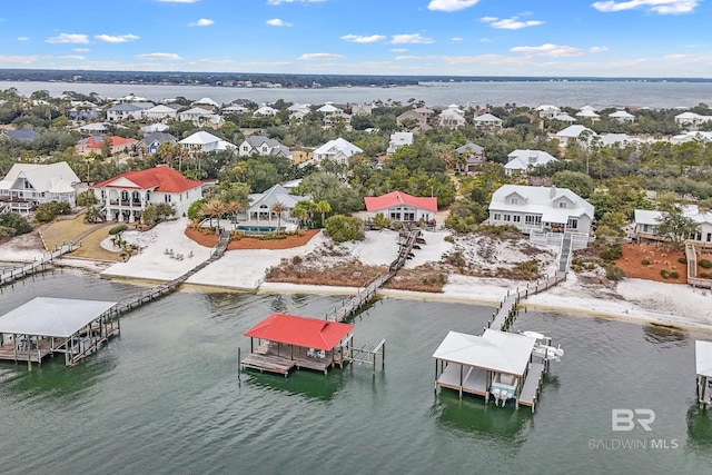 bird's eye view with a water view and a residential view