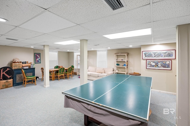 game room featuring a paneled ceiling, carpet flooring, visible vents, and baseboards