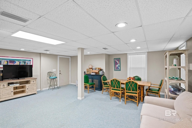 living room featuring a drop ceiling, recessed lighting, carpet flooring, visible vents, and baseboards