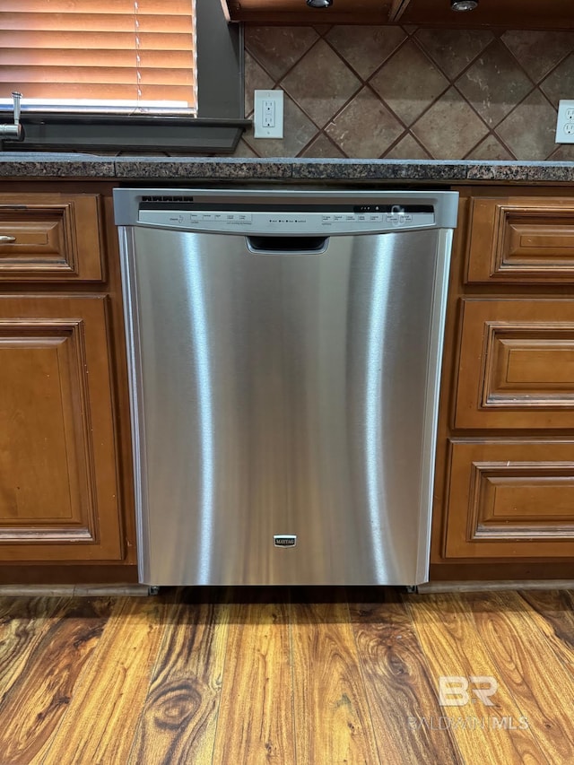 253 Cherokee St, Mobile, AL 36606 - kitchen view of dishwasher, dark countertops, and brown cabinets