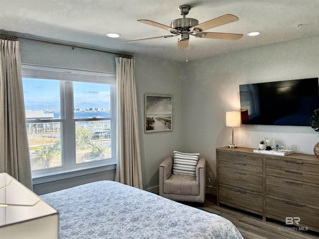 bedroom featuring hardwood / wood-style floors and ceiling fan