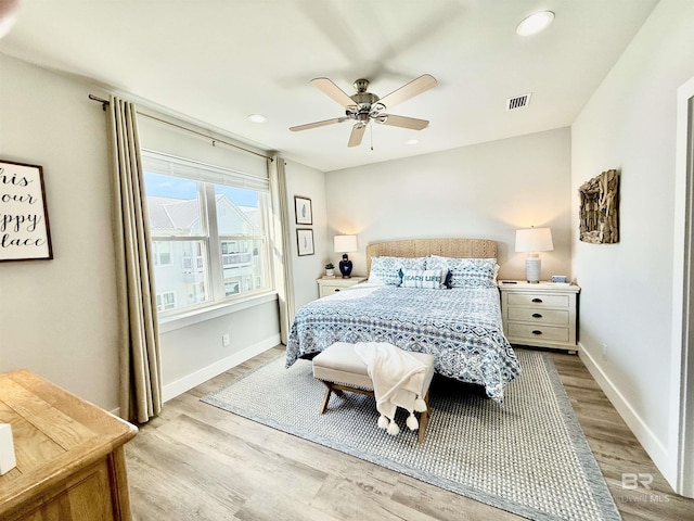 bedroom featuring light hardwood / wood-style floors and ceiling fan