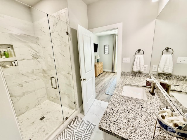 bathroom with vanity and an enclosed shower