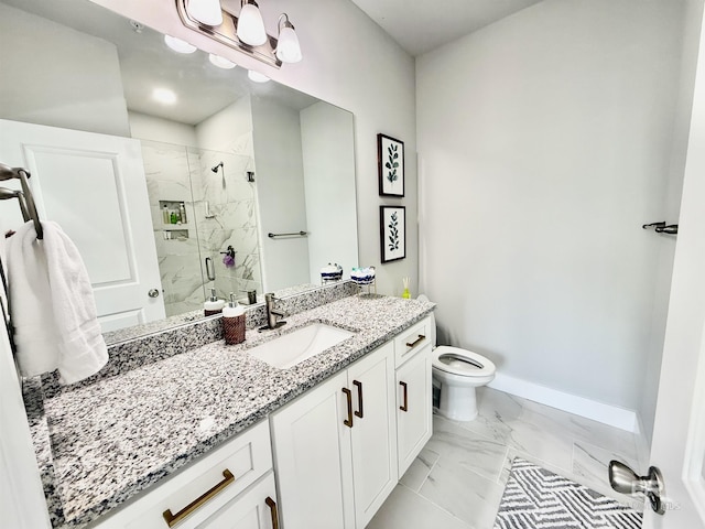 bathroom with vanity, a shower with shower door, and toilet