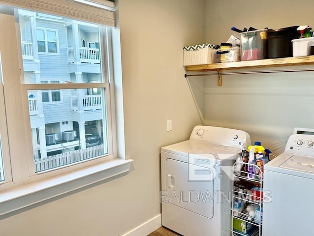 washroom with washing machine and dryer