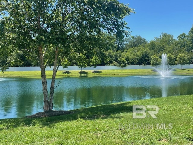 property view of water featuring fence