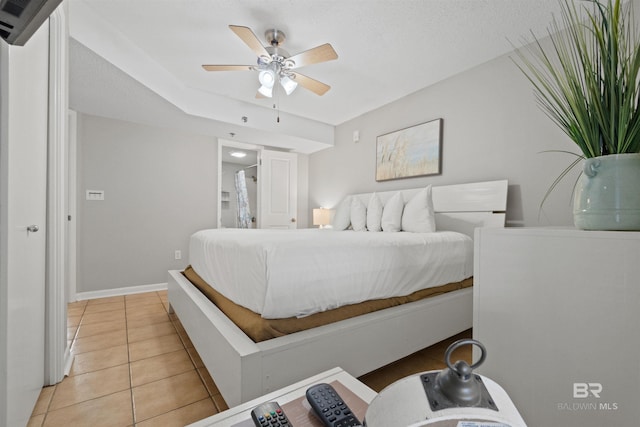 26802 Perdido Beach Blvd Unit 7C2, Orange Beach, AL 36561 - bedroom featuring an AC wall unit, baseboards, ceiling fan, and light tile patterned floors