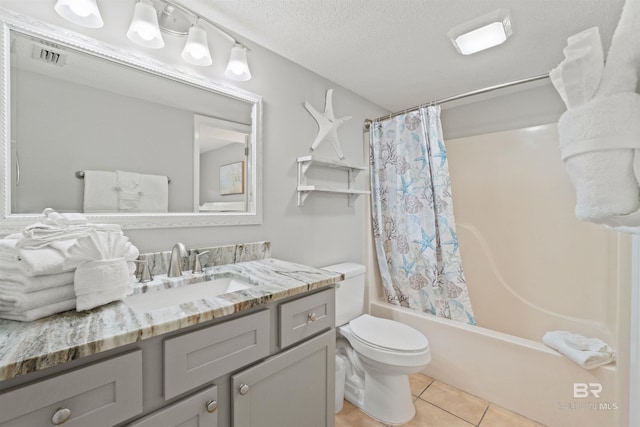 26802 Perdido Beach Blvd Unit 7C2, Orange Beach, AL 36561 - bathroom featuring a textured ceiling, tile patterned flooring, vanity, toilet, and shower / bathtub combination with curtain