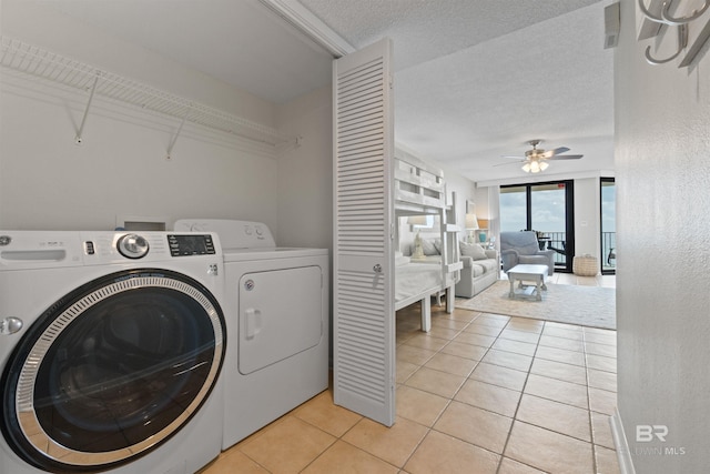 26802 Perdido Beach Blvd Unit 7C2, Orange Beach, AL 36561 - clothes washing area featuring laundry area, a ceiling fan, a textured ceiling, independent washer and dryer, and light tile patterned floors