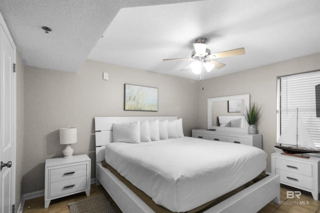 26802 Perdido Beach Blvd Unit 7C2, Orange Beach, AL 36561 - bedroom with light tile patterned floors and a ceiling fan