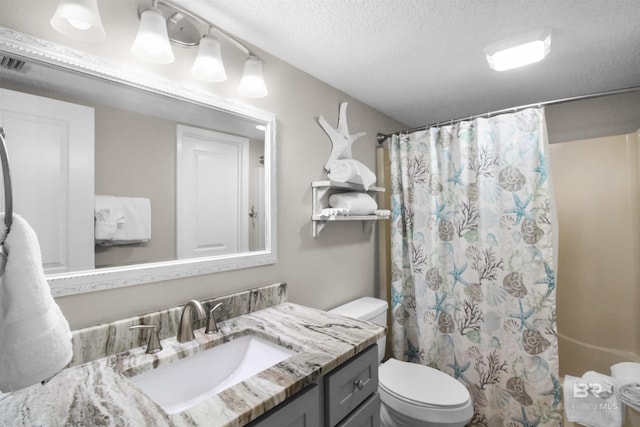 26802 Perdido Beach Blvd Unit 7C2, Orange Beach, AL 36561 - full bath with vanity, visible vents, curtained shower, toilet, and a textured ceiling
